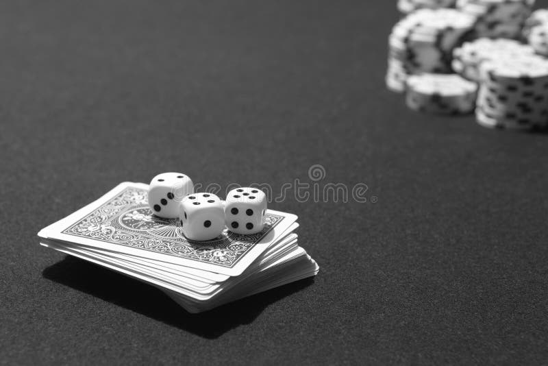 Poker cards and craps with betting chips table game. Black and white. Poker cards and craps with betting chips table game. Black and white