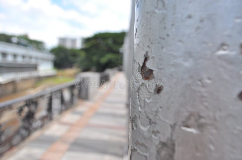 Pole object on the bridge. The poles are gray and the number is more than one