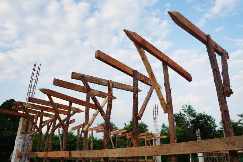 Temporary Poles and Wooden Scaffolding Support Concrete Beams at the