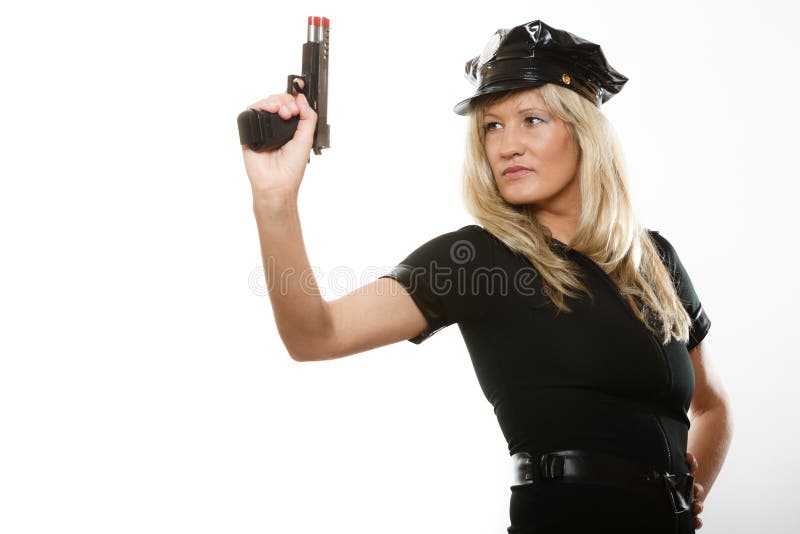 Poli de la mujer policía con el arma imagen de archivo Poli de la mujer policía con el arma imagen de archivo
