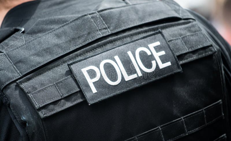 Police Badge on Black Body Armour Vest. Editorial Image - Image of ...
