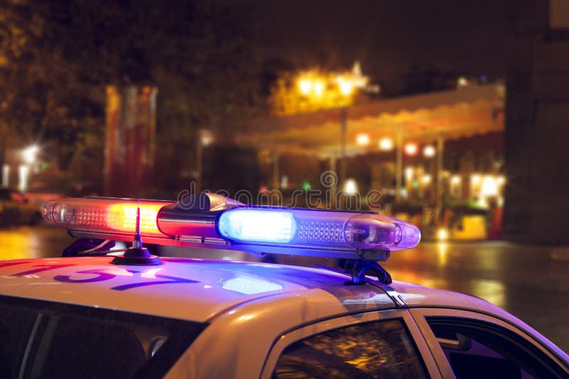 Police car on the street at night stock photography Police car on the street at night stock photography