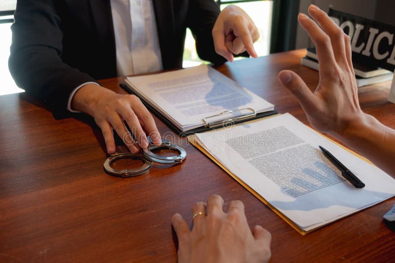 The police conducted an investigation. Inquiring about the violation of state laws Arrest the culprit offender Handcuffing. stock images The police conducted an investigation. Inquiring about the violation of state laws Arrest the culprit offender Handcuffing. stock images