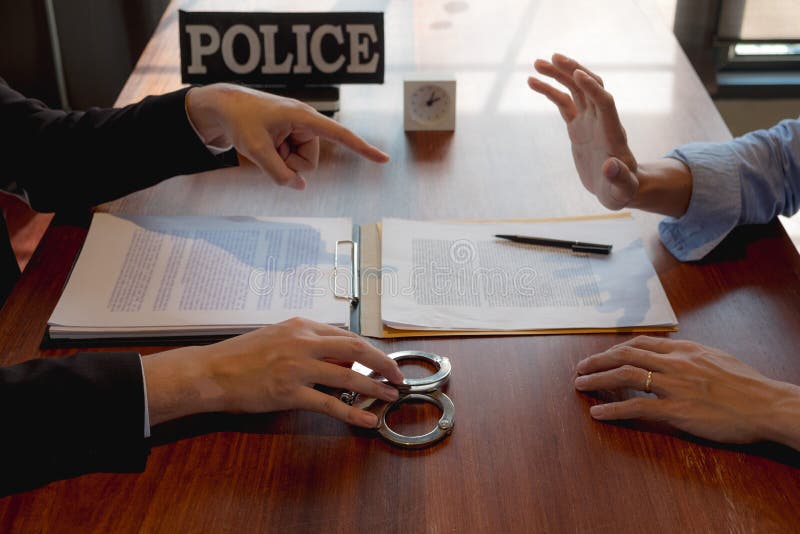 The police conducted an investigation. Inquiring about the violation of state laws Arrest the culprit offender Handcuffing. royalty free stock images The police conducted an investigation. Inquiring about the violation of state laws Arrest the culprit offender Handcuffing. royalty free stock images