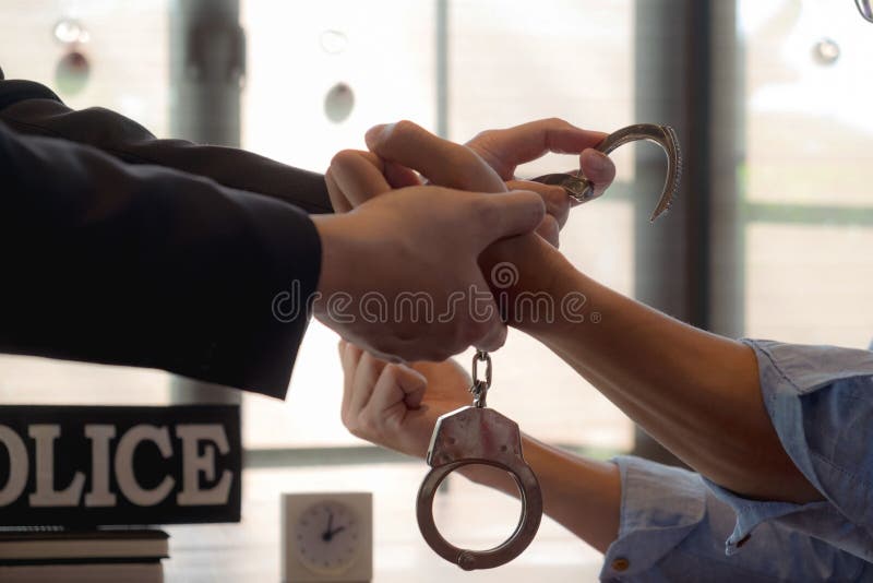 The police conducted an investigation. Inquiring about the violation of state laws Arrest the culprit offender Handcuffing. stock image The police conducted an investigation. Inquiring about the violation of state laws Arrest the culprit offender Handcuffing. stock image