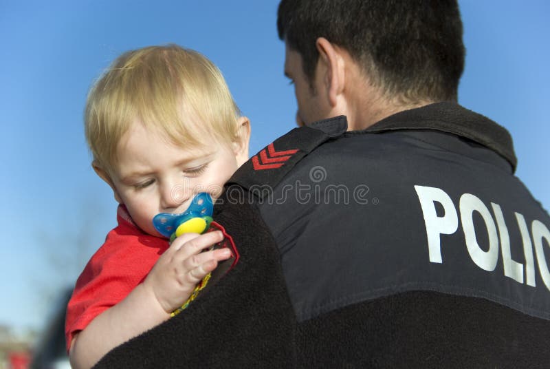 Police Officer Holds Baby