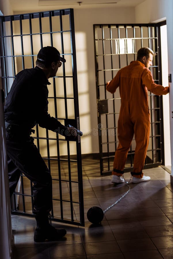 police officer pursuing escaping prisoner stock photo police officer pursuing escaping prisoner stock photo