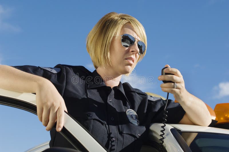 Police Officer Using Two-Way Radio
