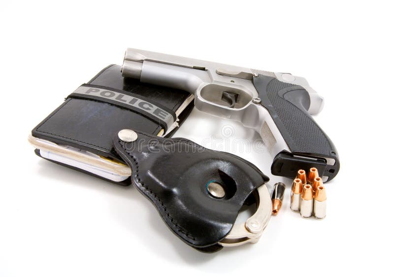 A notebook, handcuffs, pistol and ammunition used by police officers. Button clasp stock images, royalty-free photos and pictures