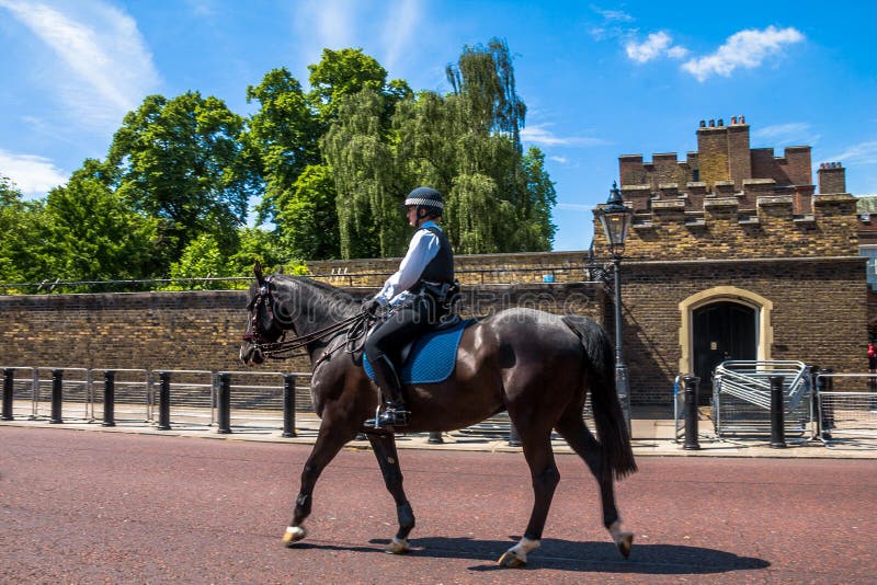 Police woman on horseback opposite St. James Palace. Selective focus