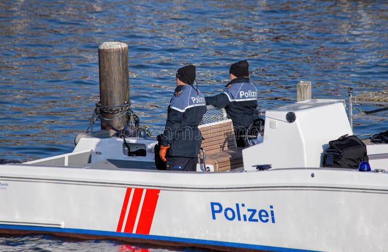 Policemen in the boat on the Limmat river