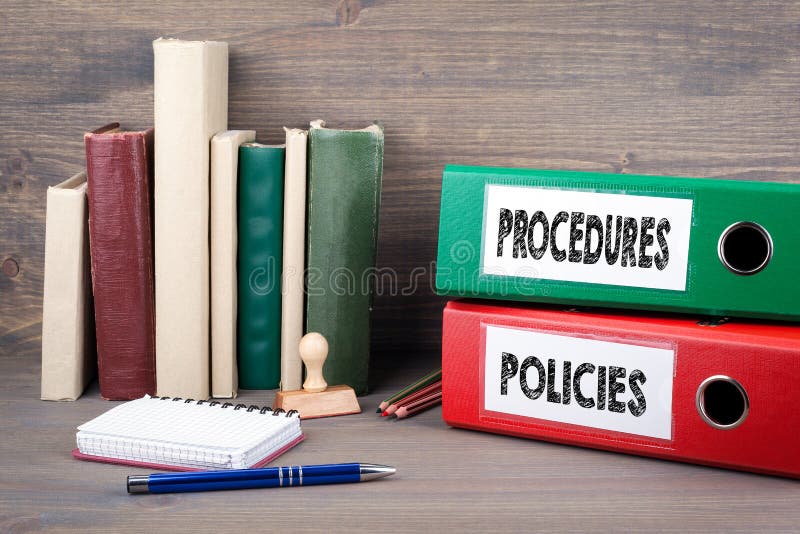 Policies and Procedures. Binders on desk in the office. Business background