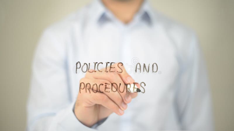 Policies and Procedures , Man writing on transparent screen