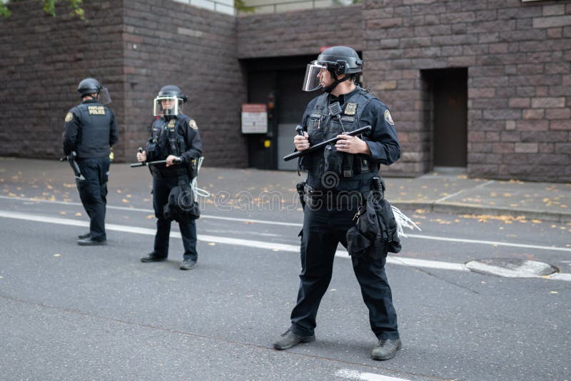 Portland, OR / USA - November 17 2018: Police in heavy riot gear during protest turned into civil disobedience. Portland, OR / USA - November 17 2018: Police in heavy riot gear during protest turned into civil disobedience