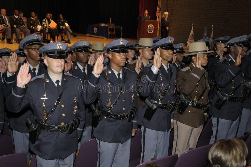 Prince George`s County police and deputy sheriffs get sworn in at the police graduation exercises in Greenbelt, Maryland. Prince George`s County police and deputy sheriffs get sworn in at the police graduation exercises in Greenbelt, Maryland