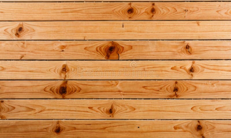 A close-up view of polished pine wood planks arranged side by side, highlighting the natural grain patterns. The wooden surface exudes simplicity and organic beauty. AI generated