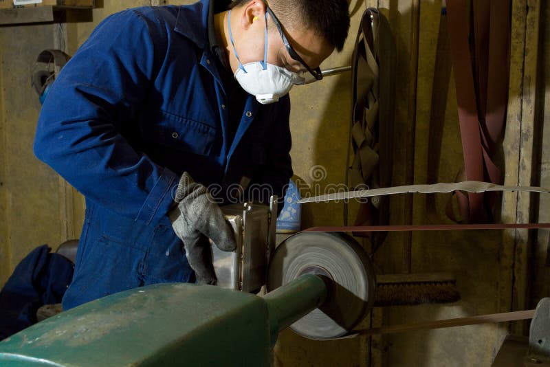 Polishing metal in workshop