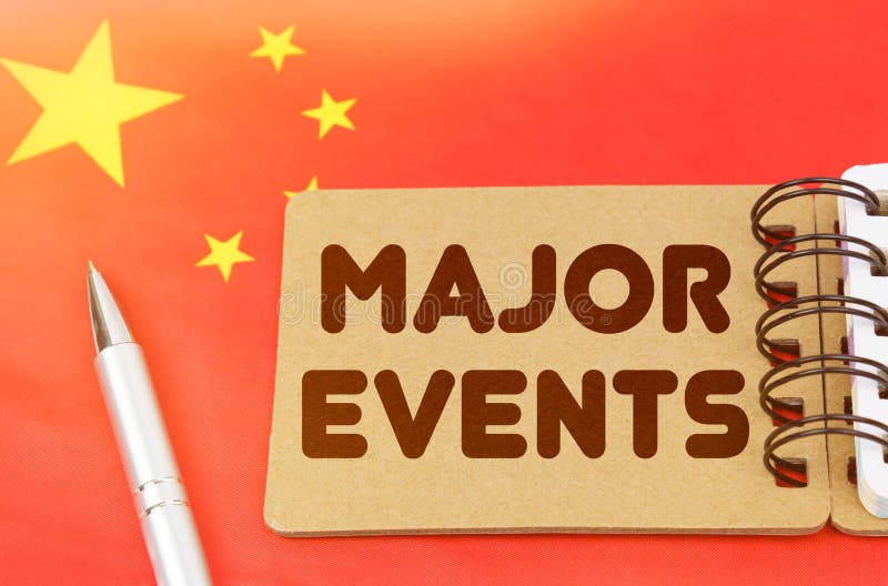 On the Flag of China Lies a Notebook with the Inscription - Major