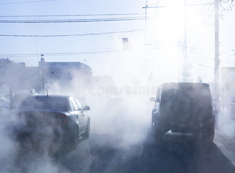 Pollution from the Exhaust of Cars in the City in the Winter. Smoke ...