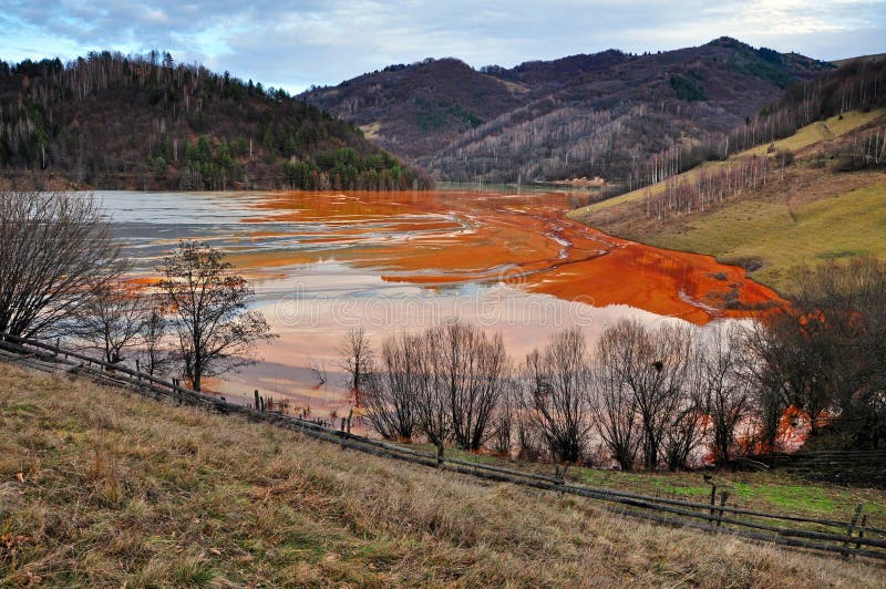 Pollution of a lake with contaminated water from a gold mine. stock photography Pollution of a lake with contaminated water from a gold mine. stock photography