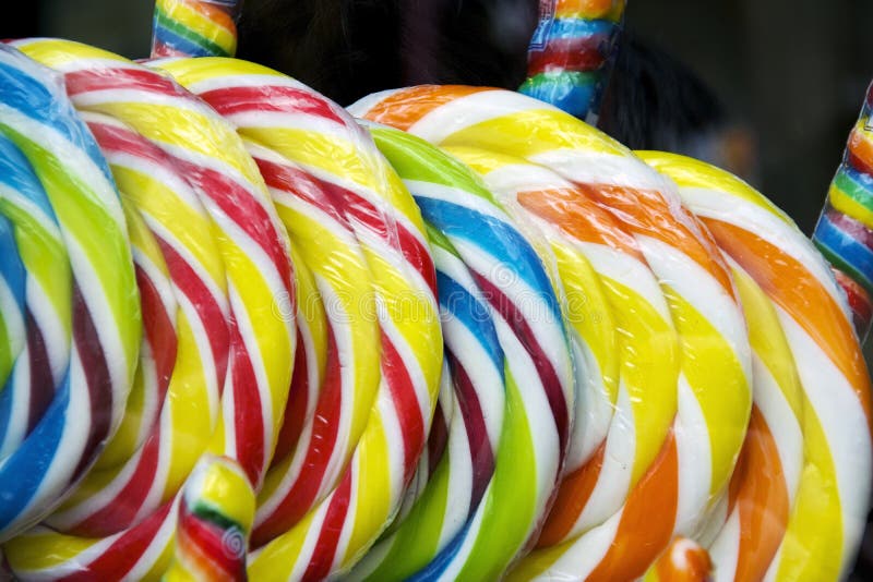 Lots of colorful lollipops on display in a shop. Lots of colorful lollipops on display in a shop