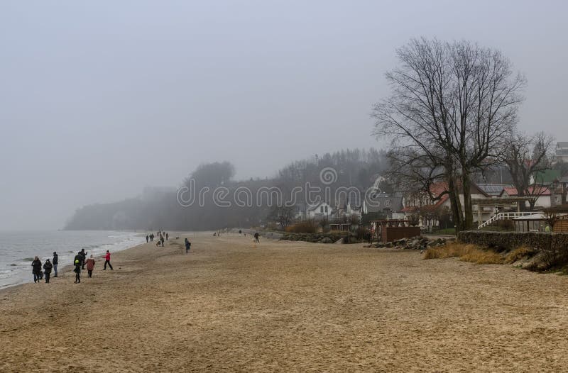 Poland Gdynia January 1, 2024 boat on the seashore in the fog. Poland Gdynia January 1, 2024 boat on the seashore in the fog.