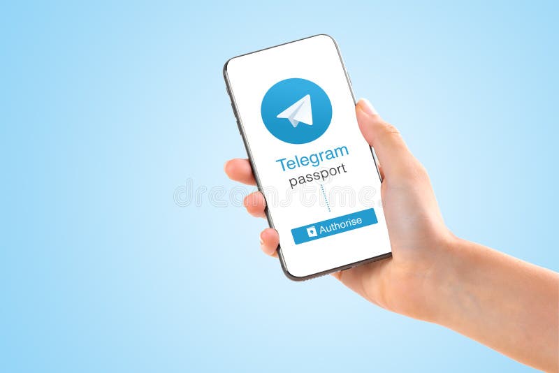 Poltava, Ukraine - July 28, 2018: Telegram application logo on smartphone in hands passport verification new feature