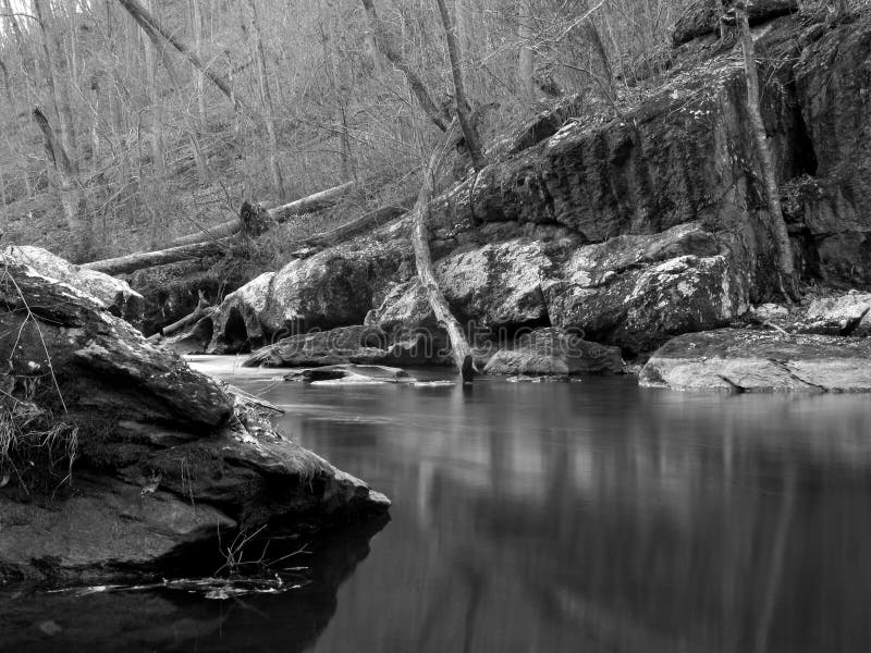 Black and White photo of the Gunpowder river in December. The Gunpowder is located north of Baltimore Maryland and is popular amongst rafters and fishermen. This quiet scene was taken on the upper Gunpowder. Black and White photo of the Gunpowder river in December. The Gunpowder is located north of Baltimore Maryland and is popular amongst rafters and fishermen. This quiet scene was taken on the upper Gunpowder.