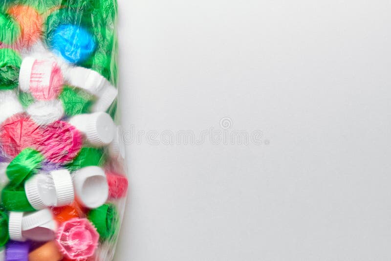 Polyethylene garbage bag with plastic lids of different colors and copy space royalty free stock images