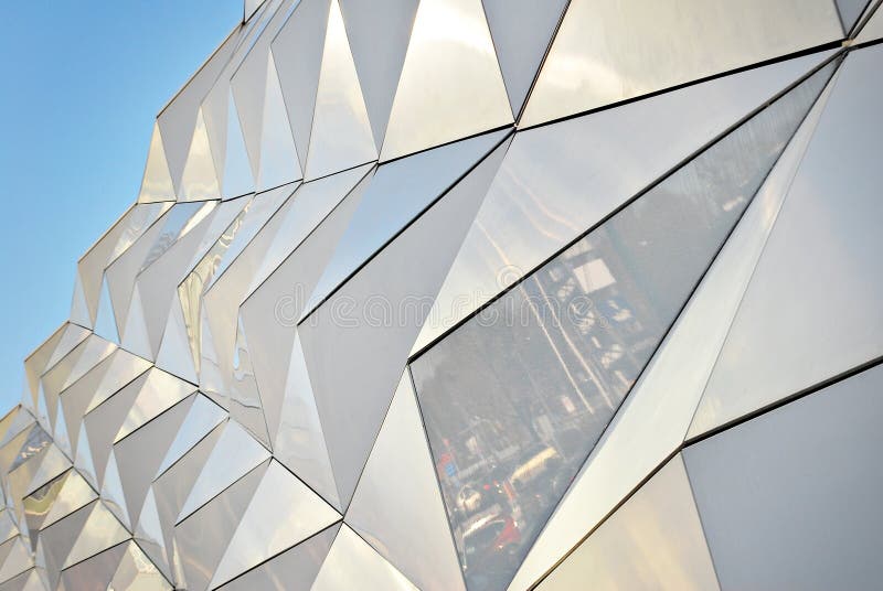 Polygonal Triangle Glass Facade of Modern Building. Stock Photo Image