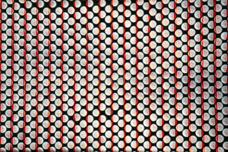 Close-up macro of close aligned polymer electrolytic capacitors communications hardware electronics components packed for mass royalty free stock photo Close-up macro of close aligned polymer electrolytic capacitors communications hardware electronics components packed for mass royalty free stock photo