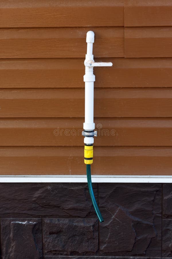 Polypropylene Pipe with a Tap on Siding Wall Stock Image Image of