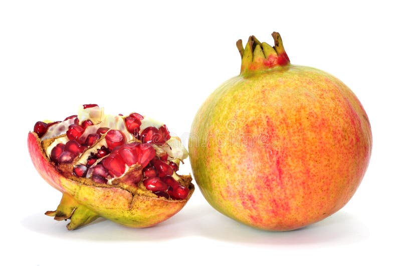 Some pomegranate fruits isolated on a white background