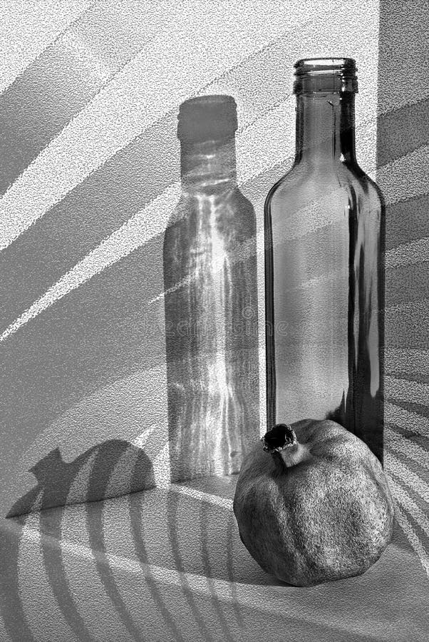 Pomegranate, bottle and shadows. Still life.