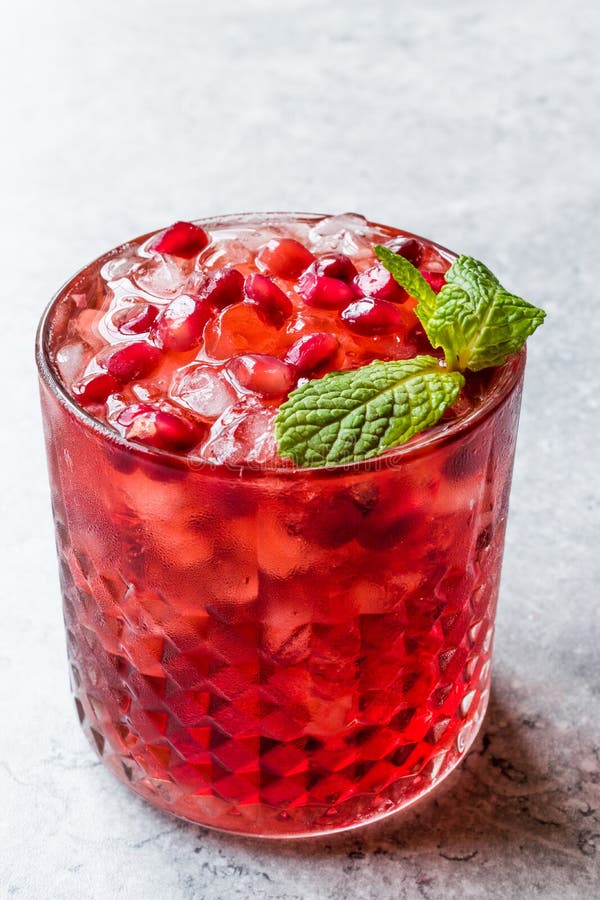 Pomegranate Cocktail with Mint Leaves and Crushed Ice. Stock Photo
