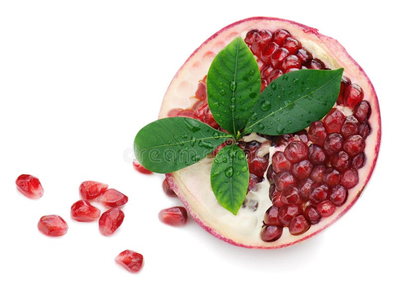 Pomegranate fruit with green leaves on white background