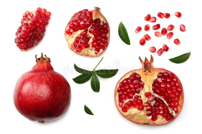 pomegranate fruit with seeds and green leaves isolated on white background top view