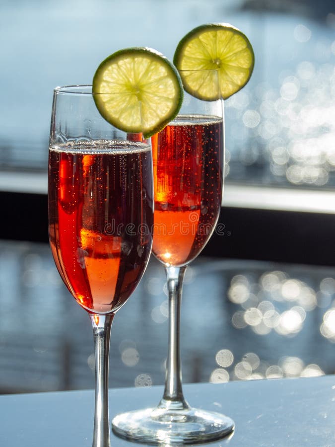Pomegranate mimosas on the River. It was a perfect morning for these colorful mimosas at an open air restaurant along the Cape Fear River royalty free stock image Pomegranate mimosas on the River. It was a perfect morning for these colorful mimosas at an open air restaurant along the Cape Fear River royalty free stock image