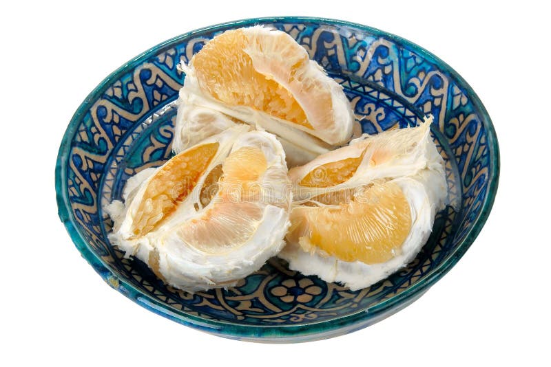 Pomelo fruit on blue ornament dish