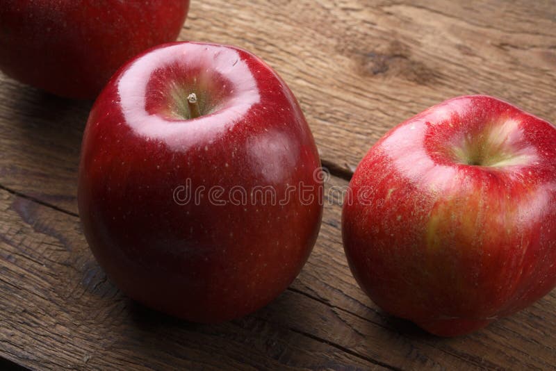 Red delicious apples on a wooden background. Red delicious apples on a wooden background