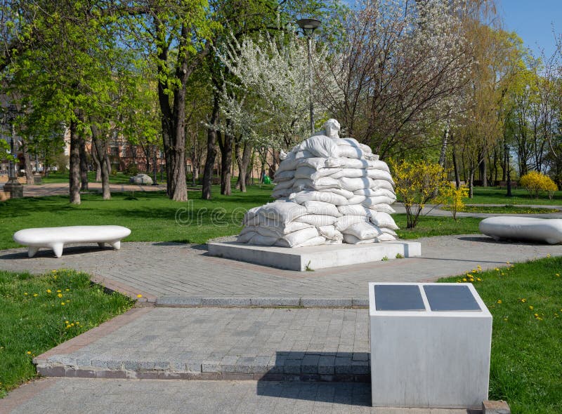 Monument to Dante Alighieri protected by sandbags from Russian missile during war Kyiv Volodymyrska Hill. Monument to Dante Alighieri protected by sandbags from Russian missile during war Kyiv Volodymyrska Hill