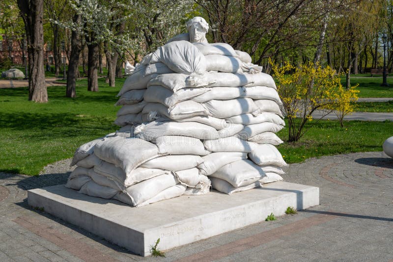 Monument to Dante Alighieri protected by sandbags from Russian missile during war Kyiv Volodymyrska Hill. Monument to Dante Alighieri protected by sandbags from Russian missile during war Kyiv Volodymyrska Hill