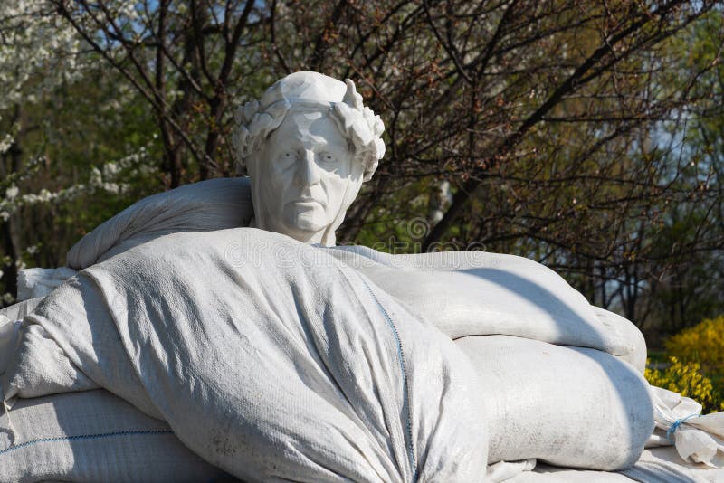 Monument to Dante Alighieri protected by sandbags from Russian missile during war Kyiv Volodymyrska Hill. Monument to Dante Alighieri protected by sandbags from Russian missile during war Kyiv Volodymyrska Hill