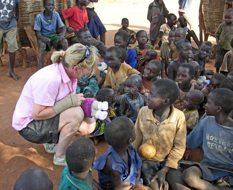 An Australian volunteer aid worker delivers more than just much needed food staple, medical and hygiene supplies to a remote village in Uganda, Africa, she also brings comfort with hand knitted soft toys that result in hope, joy and many many beautiful smiles among the very needy children of a remote African village in Karamoja, Uganda. This photo is to be used only for editorial purposes only in truthful articles. An Australian volunteer aid worker delivers more than just much needed food staple, medical and hygiene supplies to a remote village in Uganda, Africa, she also brings comfort with hand knitted soft toys that result in hope, joy and many many beautiful smiles among the very needy children of a remote African village in Karamoja, Uganda. This photo is to be used only for editorial purposes only in truthful articles.