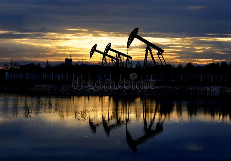 Oil derrick pumps oil or natural gas from underground. Oil derrick pumps oil or natural gas from underground