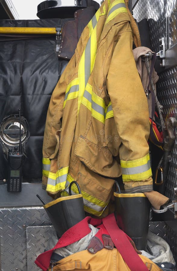 A firemans gear in a fire truck. A firemans gear in a fire truck