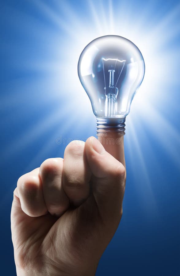 Hand with shining light bulb on blue. Hand with shining light bulb on blue