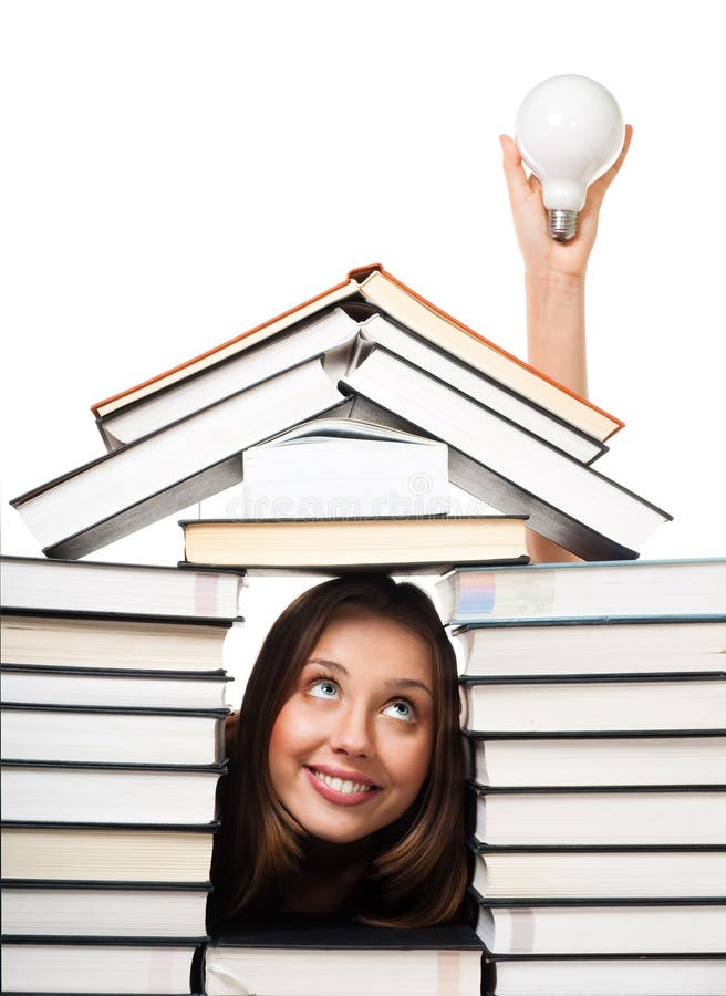 Positive woman smile in house made of books has an idea depicted with big bulb. Positive woman smile in house made of books has an idea depicted with big bulb