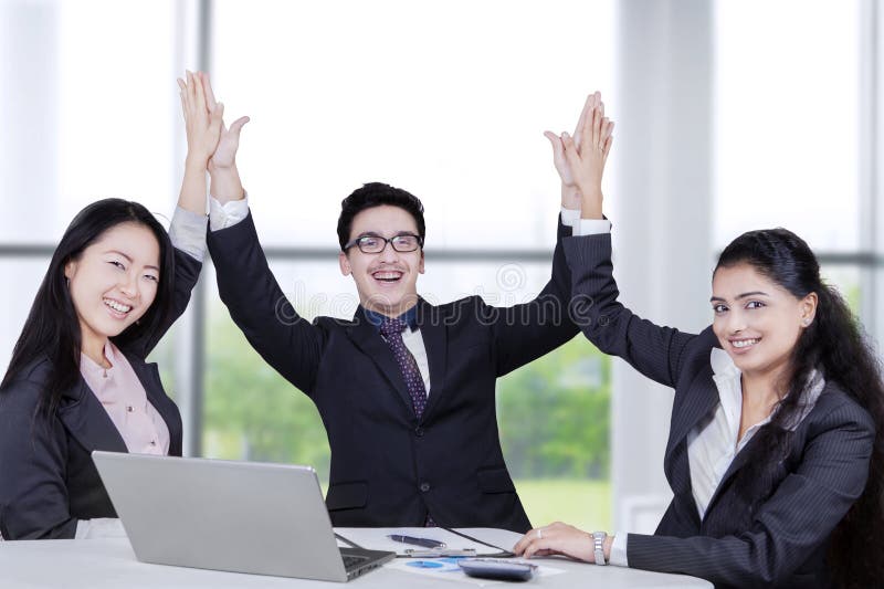 Portrait of multiracial business team celebrate their achievement in the office. Portrait of multiracial business team celebrate their achievement in the office