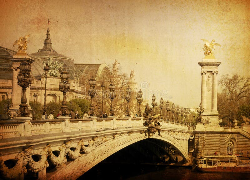 Pont Alexandre III is an arch bridge that spans the Seine, widely regarded as the most ornate, extravagant bridge in Paris. Pont Alexandre III is an arch bridge that spans the Seine, widely regarded as the most ornate, extravagant bridge in Paris.